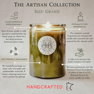 A lit Yuzami™ - 12oz Finely Crafted Scented Candle by Begonia & Bench® stands on a grey surface. Icons indicate the scented candle is clean burning, made with biodegradable natural wax, eco-friendly packaging, phthalate-free fragrances, and partnered with the National Forest Foundation to plant trees. Text reads "The Artisan Collection, Size: Grand, Handcrafted.